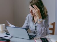 women looking at her laptop